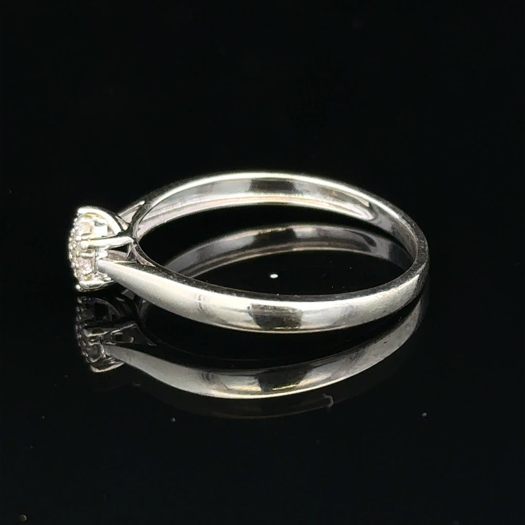 9ct white gold diamond ring in size R1/2, featuring a sparkling diamond set in an elegant unbranded jewelry design.