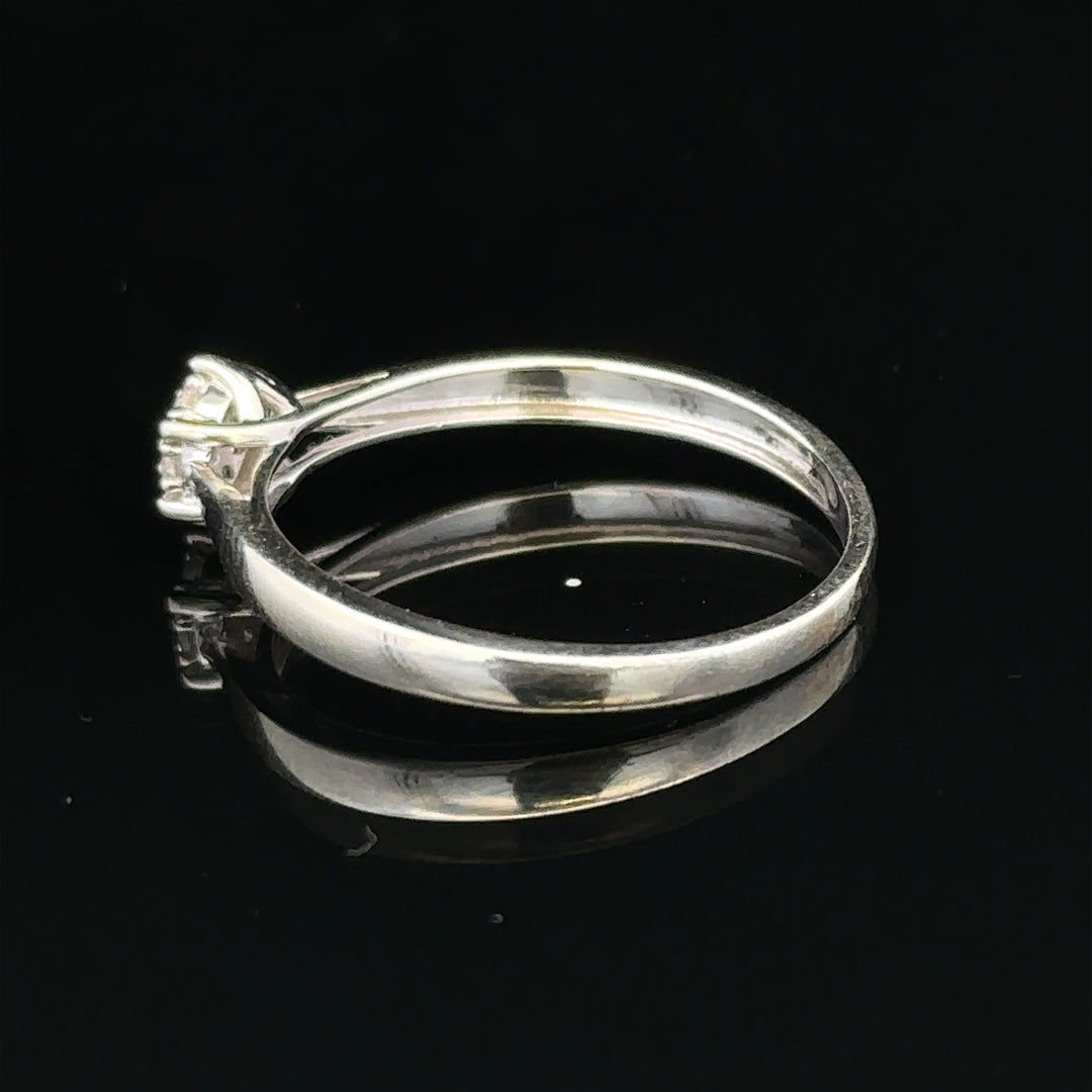 9ct white gold diamond ring in size R1/2, featuring a sparkling diamond setting and a sleek, polished band.