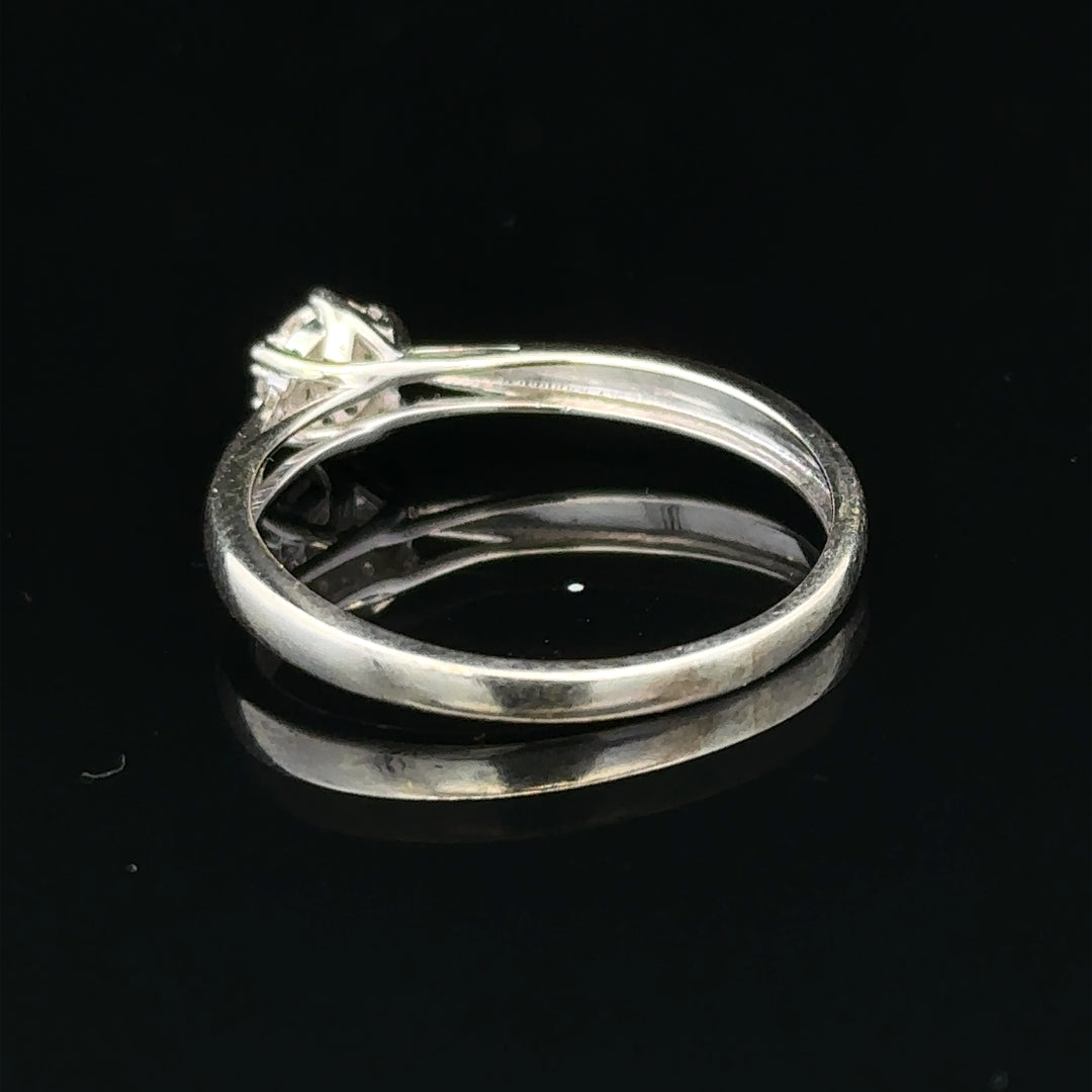 9ct white gold diamond ring in size R1/2, featuring a sparkling diamond set in a sleek, elegant band.