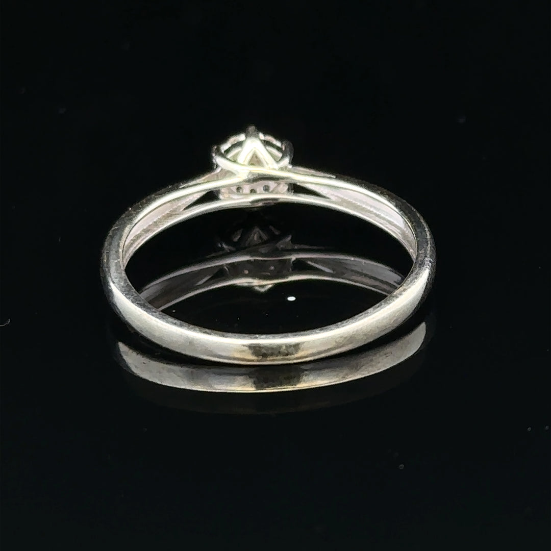 9ct white gold diamond ring in size R1/2, featuring a sparkling diamond set in a sleek band.