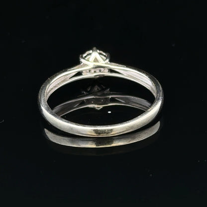 9ct white gold diamond ring in size R1/2, featuring a sparkling diamond set in a sleek band.