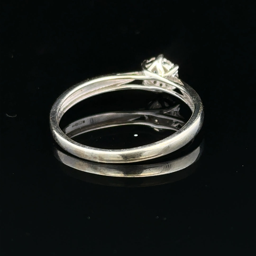 9ct white gold diamond ring in size R1/2, showcasing a sparkling diamond setting on a sleek band.