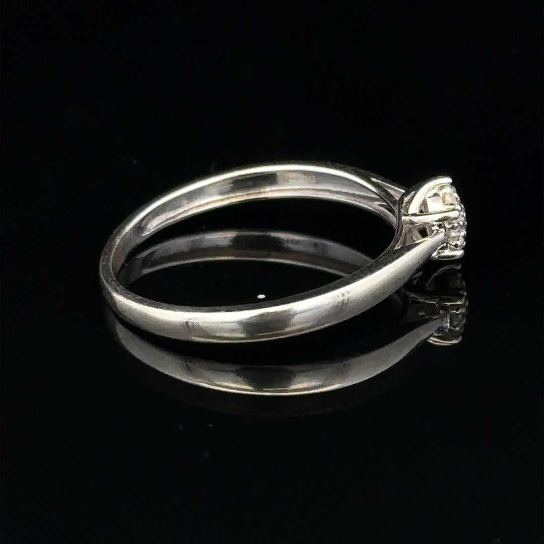 9ct white gold diamond ring in size R1/2, featuring a sparkling diamond setting and a sleek, elegant band.