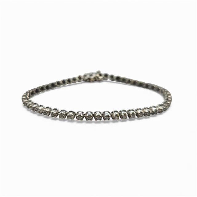 9ct white gold diamond tennis bracelet with sparkling diamonds, showcasing elegant craftsmanship and a sleek design.