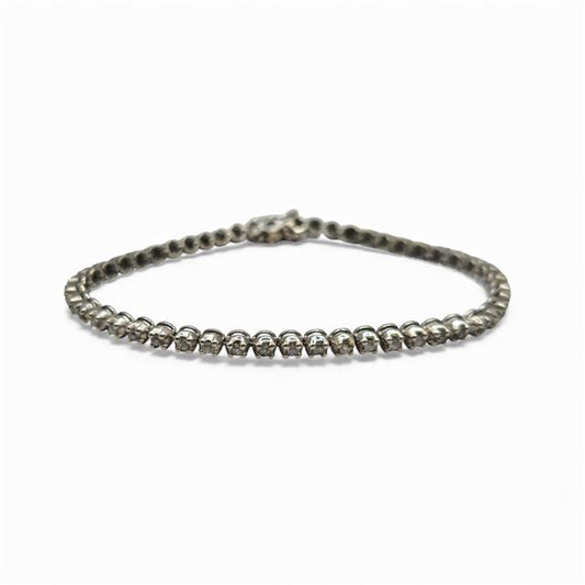 9ct white gold diamond tennis bracelet with sparkling diamonds, showcasing elegant craftsmanship and a sleek design.