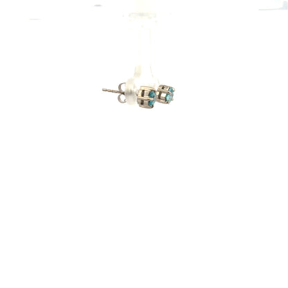 Pair of 9ct white gold earrings weighing 1.3g, unbranded jewelry with simple, elegant design, shown from the front.