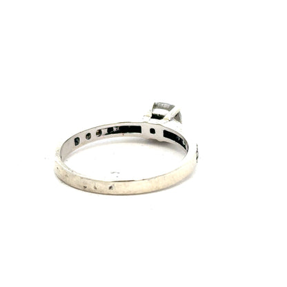 9ct white gold mossainte ring in size R, showcasing a delicate design with polished finish and intricate mossainte gemstone setting.