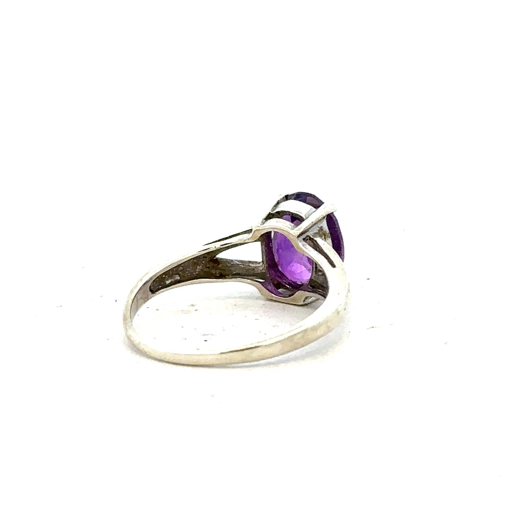 9ct white gold ring size K with a smooth band, unbranded jewelry piece, shiny and polished for elegant wear.