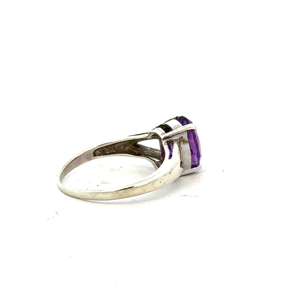 9ct white gold ring in size K with a sleek, polished finish, featuring a simple and elegant design.