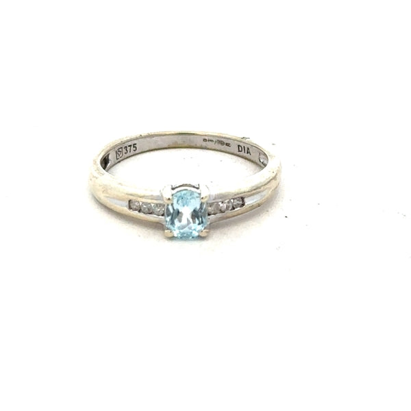 9ct white gold ring in size L with a sleek, polished finish, featuring a classic band design.
