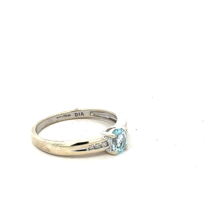9ct white gold ring in size L with a sleek, polished finish, showcasing an elegant design.