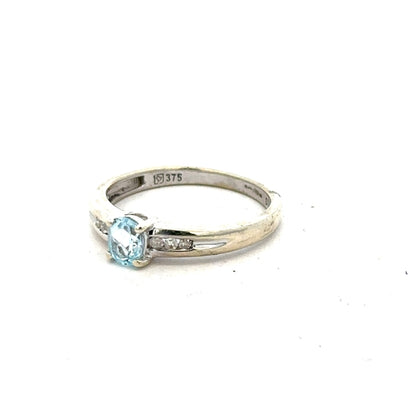 9ct white gold ring in size L with a smooth band, unbranded jewelry piece showcasing elegant craftsmanship.