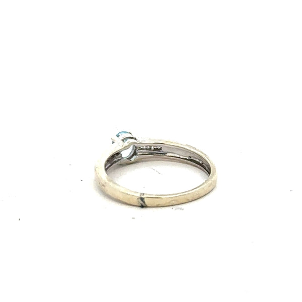 9ct white gold ring in size L with a sleek, polished finish, featuring a classic band design.