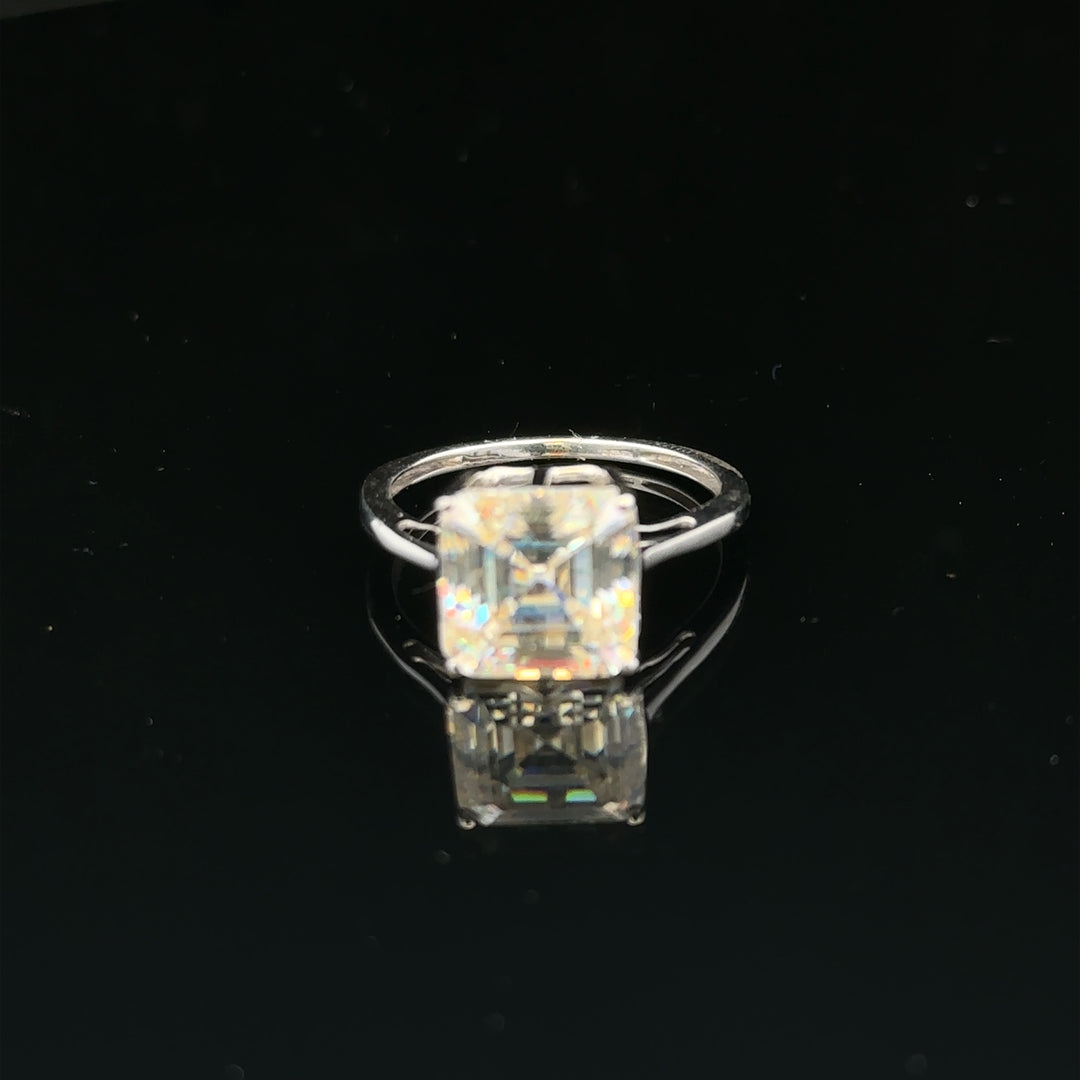 9ct white gold ring in size L, featuring a simple band design, unbranded jewelry with a polished finish.