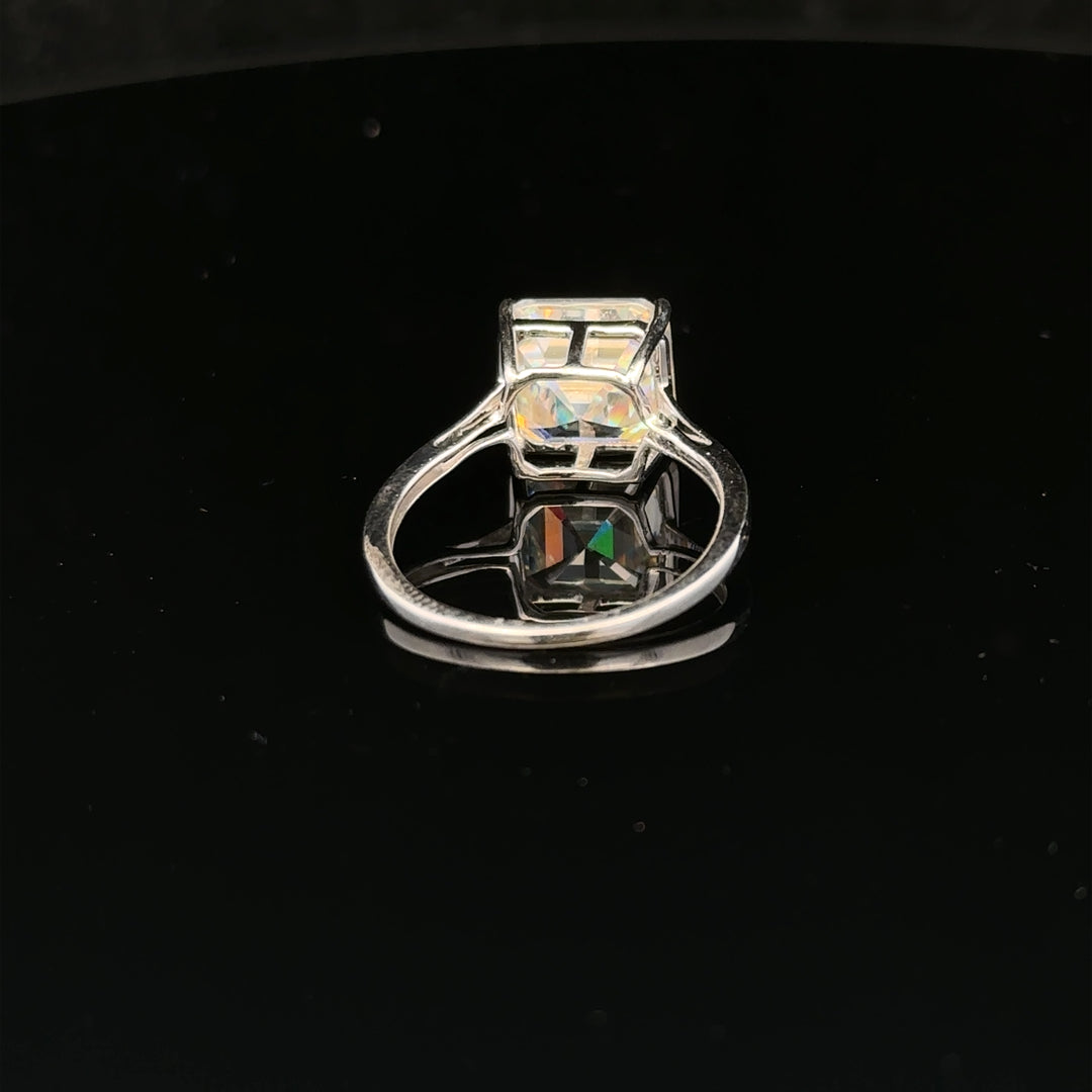 9ct white gold ring in size L with a simple band design, unbranded jewelry piece displayed on a neutral background.