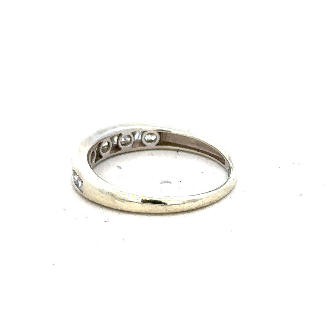 9ct white gold ring size L with a smooth band, unbranded jewelry piece displayed on a plain background.