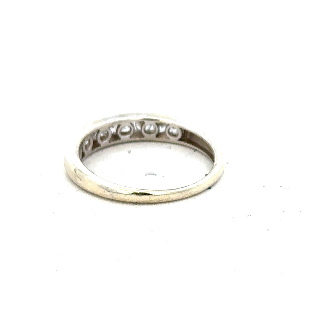 9ct white gold ring in size L, unbranded, with a smooth polished band, shown on a plain background.