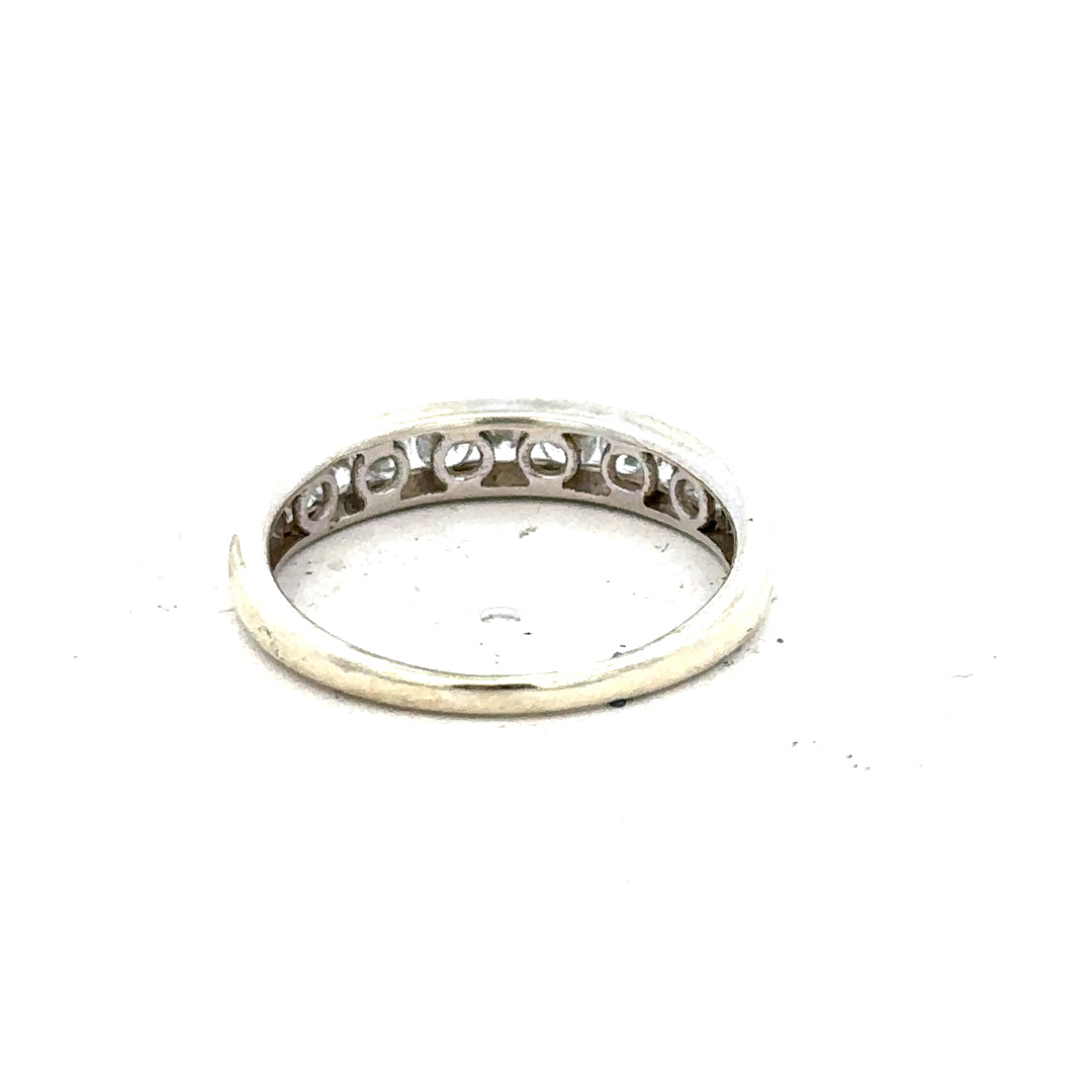 9ct white gold ring in size L, unbranded, showcasing a smooth, polished band with a subtle shine.