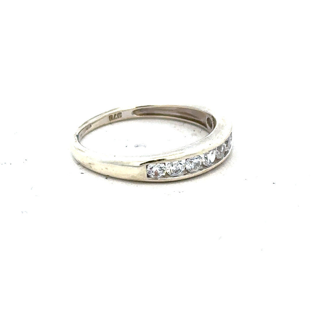 9ct white gold ring in size L, unbranded, showcasing a smooth, polished band with a sleek, elegant design.