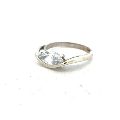 9ct white gold ring in size O with a sleek, polished finish, unbranded jewelry displayed on a neutral background.