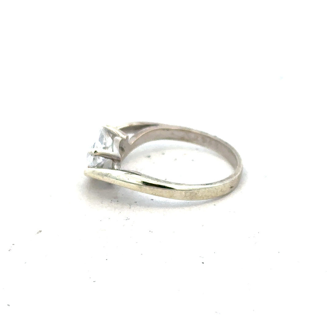 9ct white gold ring size O with a sleek design, unbranded jewelry piece showcasing a polished finish and elegant craftsmanship.