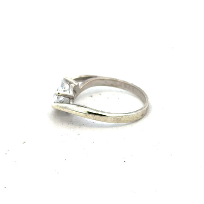 9ct white gold ring size O with a sleek design, unbranded jewelry piece showcasing a polished finish and elegant craftsmanship.