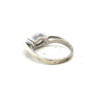 9ct white gold ring in size O with a smooth polished band, unbranded jewelry piece.