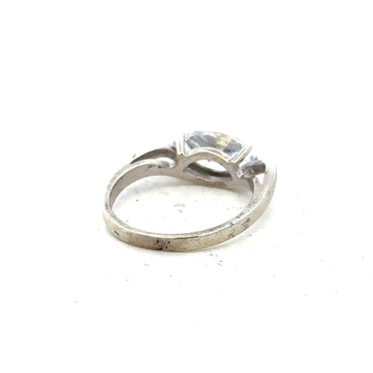 9ct white gold ring in size O with a smooth band, unbranded jewelry, shown from a front view.