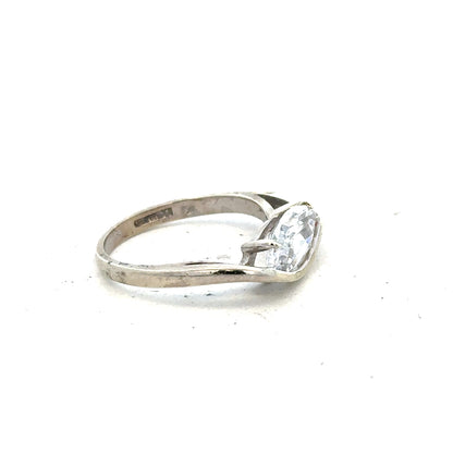 9ct white gold ring in size O with a smooth band, unbranded jewelry piece displayed on a plain background.