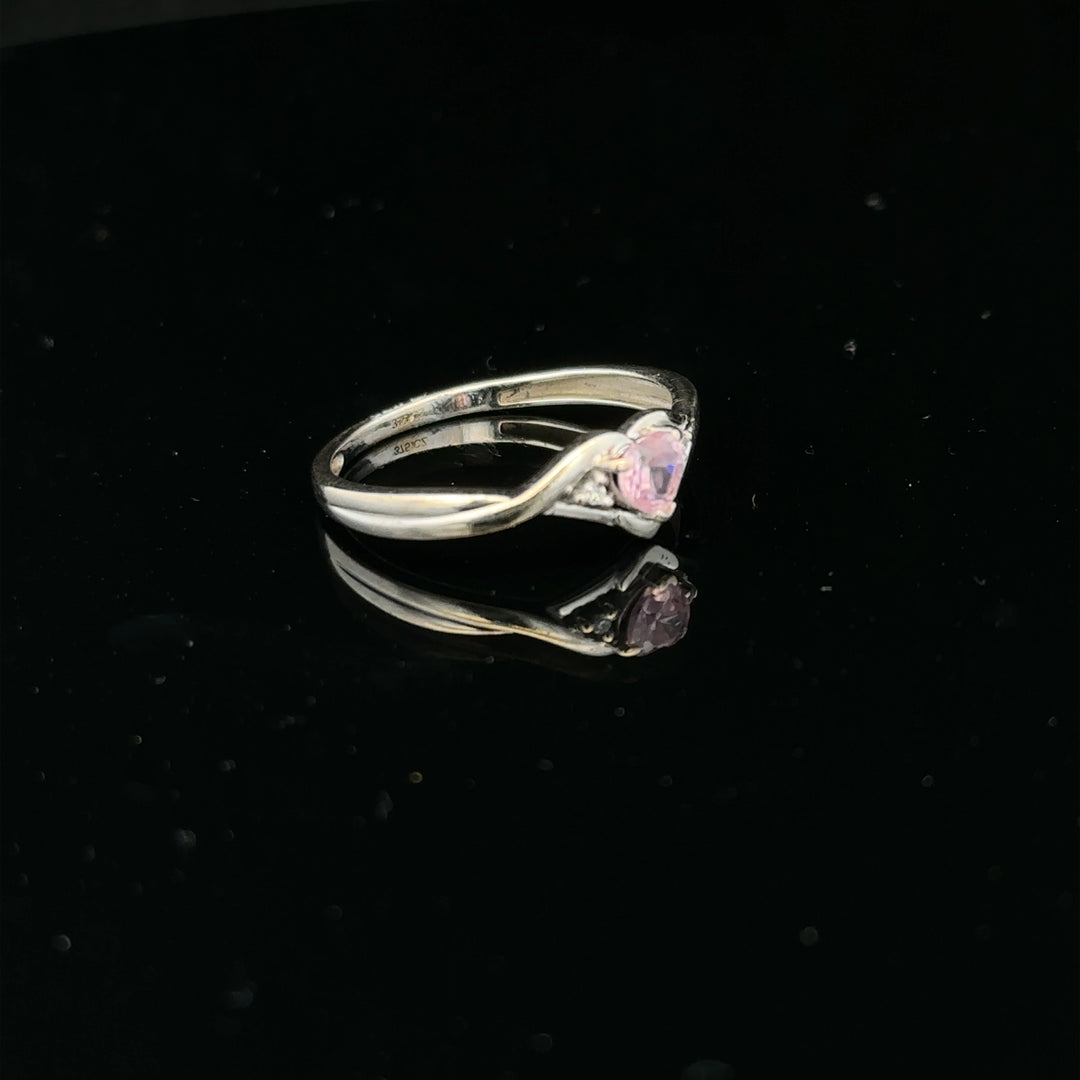 9ct white gold ring in size O with a smooth band, unbranded jewelry piece, displayed against a neutral background.