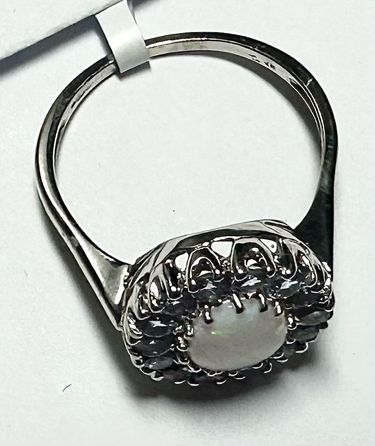 9ct white gold ring in size S with a smooth band, unbranded jewelry piece on a neutral background.
