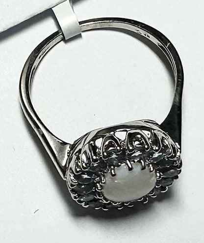 9ct white gold ring in size S with a smooth band, unbranded jewelry piece on a neutral background.