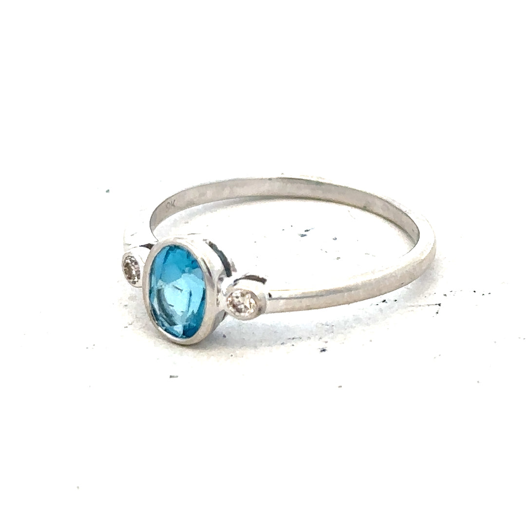 9ct white gold topaz and diamond ring in size Q, showcasing sparkling gemstones and elegant design.