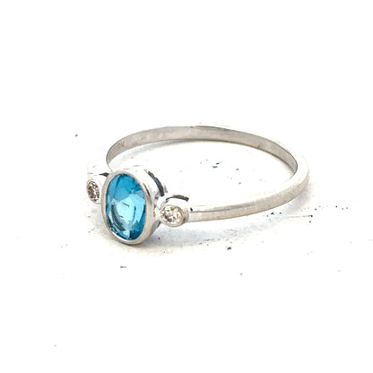 9ct white gold topaz and diamond ring in size Q, showcasing sparkling gemstones and elegant design.
