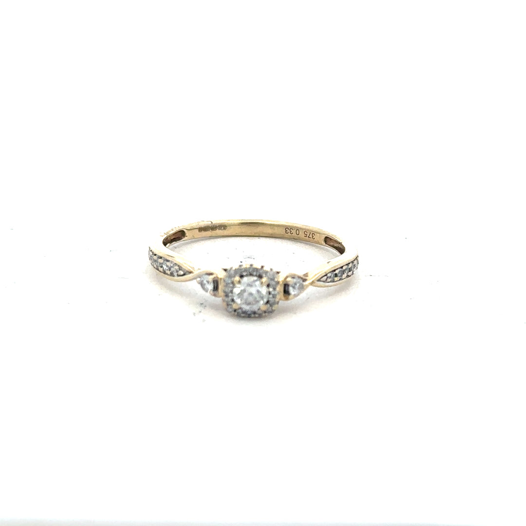 9ct yellow gold diamond ring with 0.33 carats, size S, featuring a sparkling central diamond and a sleek gold band.