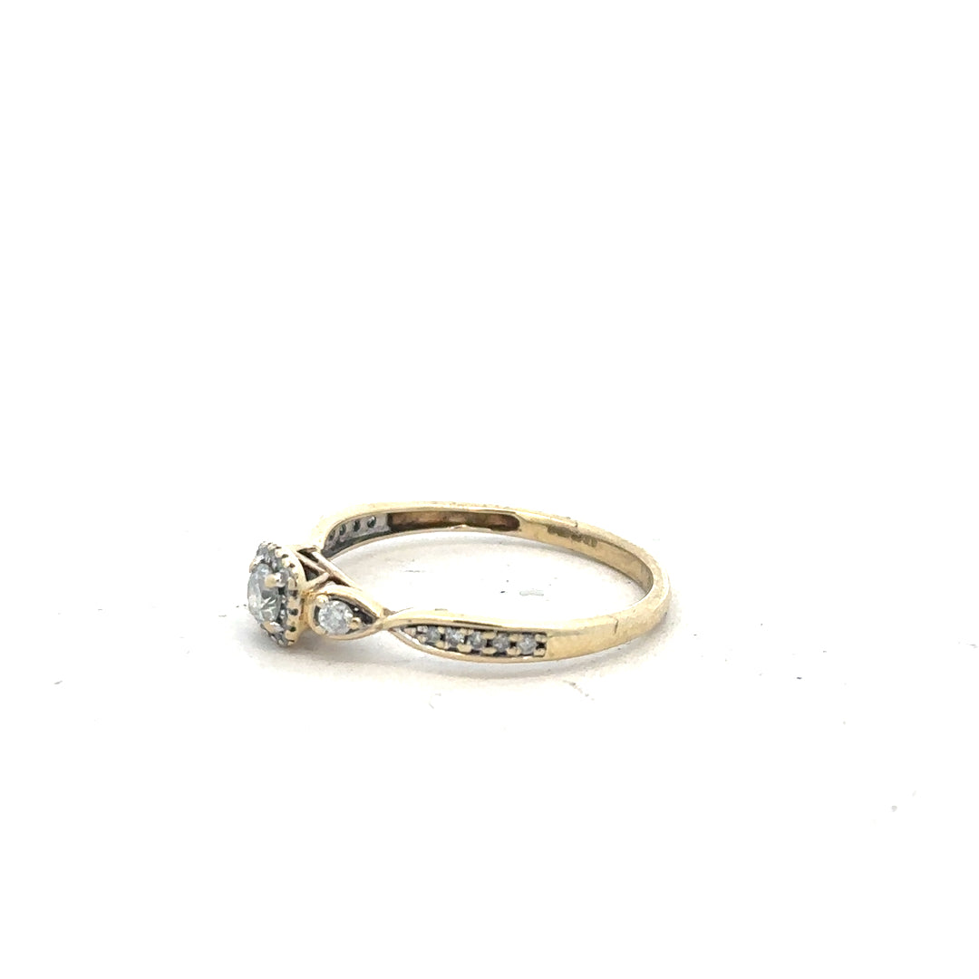 9ct yellow gold diamond ring with 0.33 carats, size S, featuring a sparkling central diamond and elegant gold band.