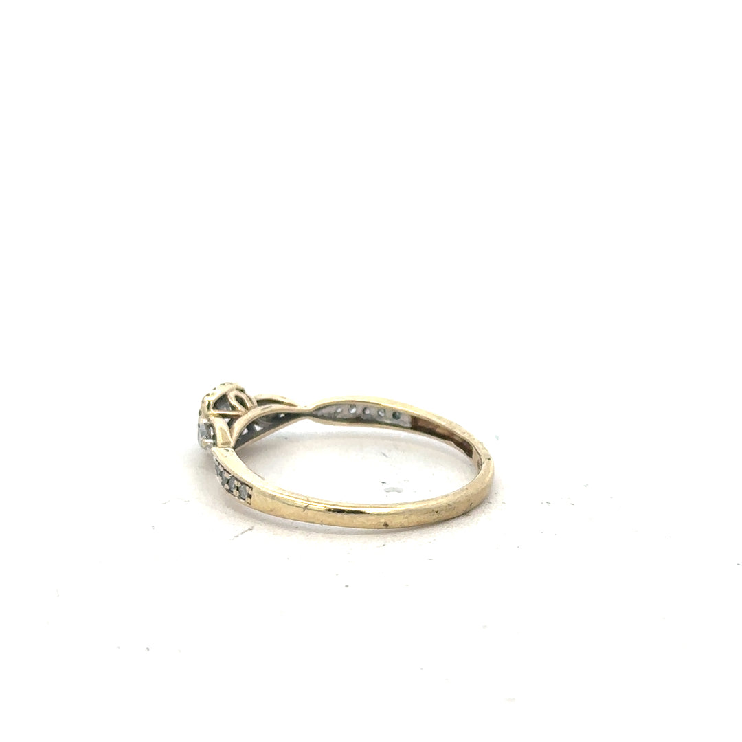 9ct yellow gold diamond ring with 0.33 carats, size S, featuring a sparkling central diamond on a sleek band.