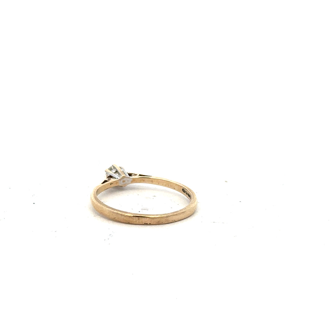 9ct yellow gold diamond ring with 20pts of diamonds in size N1/2, showcasing a sleek and elegant jewelry design.