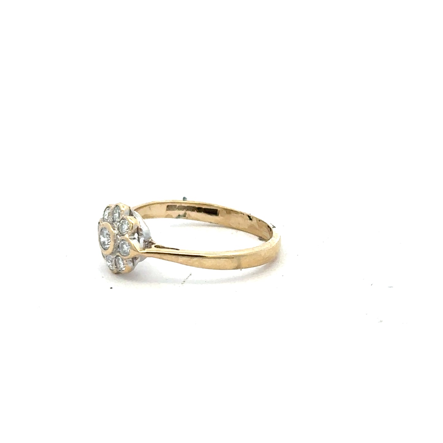 9ct yellow gold diamond ring with 25 points, size L, featuring a sleek design and sparkling stones on a plain background.