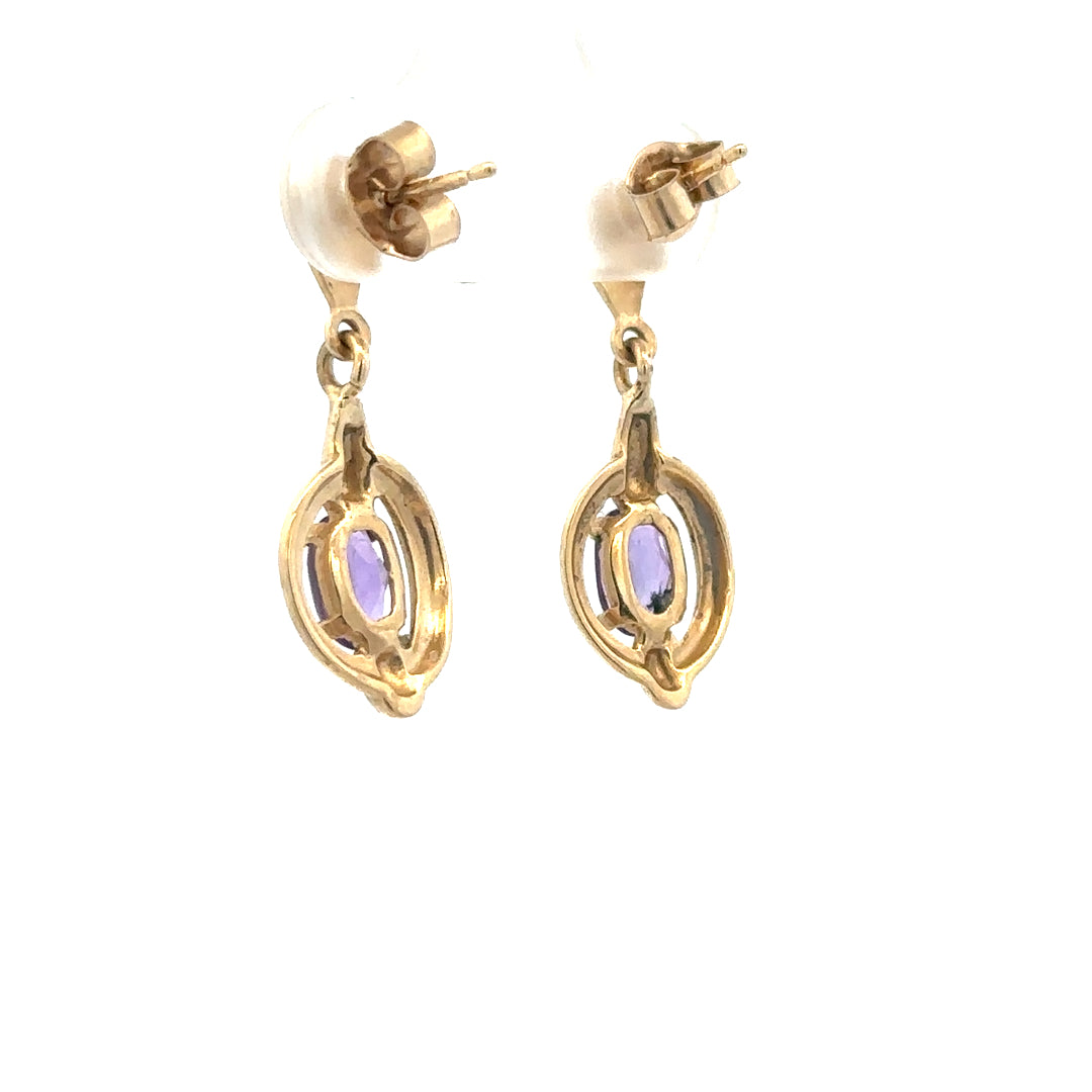9ct yellow gold amethyst earrings with silver hooks, showcasing oval-shaped purple amethyst gemstones and elegant design.