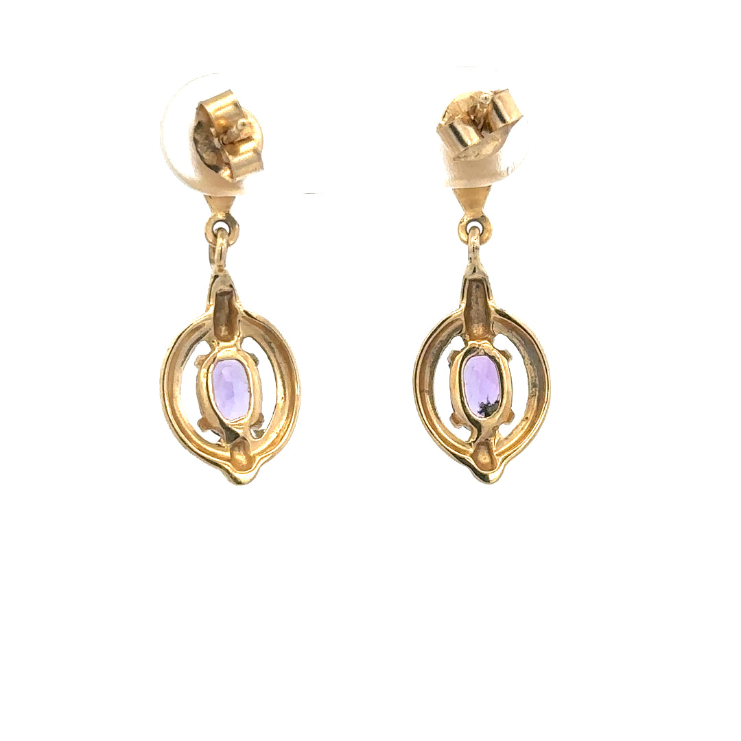 9ct yellow gold amethyst earrings with lavender gemstones, weight 2.1g, featuring elegant stud design.