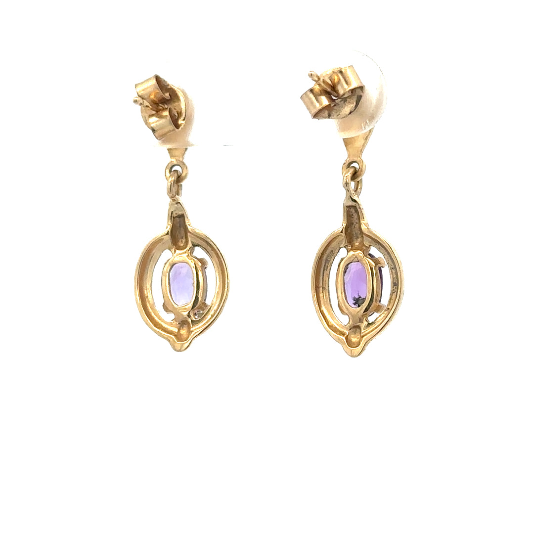 9ct yellow gold amethyst earrings featuring purple gemstones set in elegant gold, weighing 2.1g.