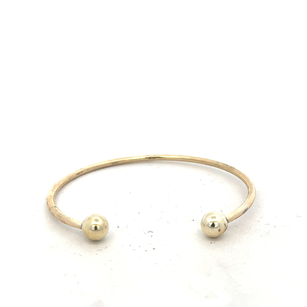 9ct yellow gold bracelet bangle weighing 12.7g, unbranded jewelry accessory with a smooth, polished finish.