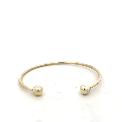 9ct yellow gold bracelet bangle weighing 12.7g, unbranded jewelry accessory with a smooth, polished finish.