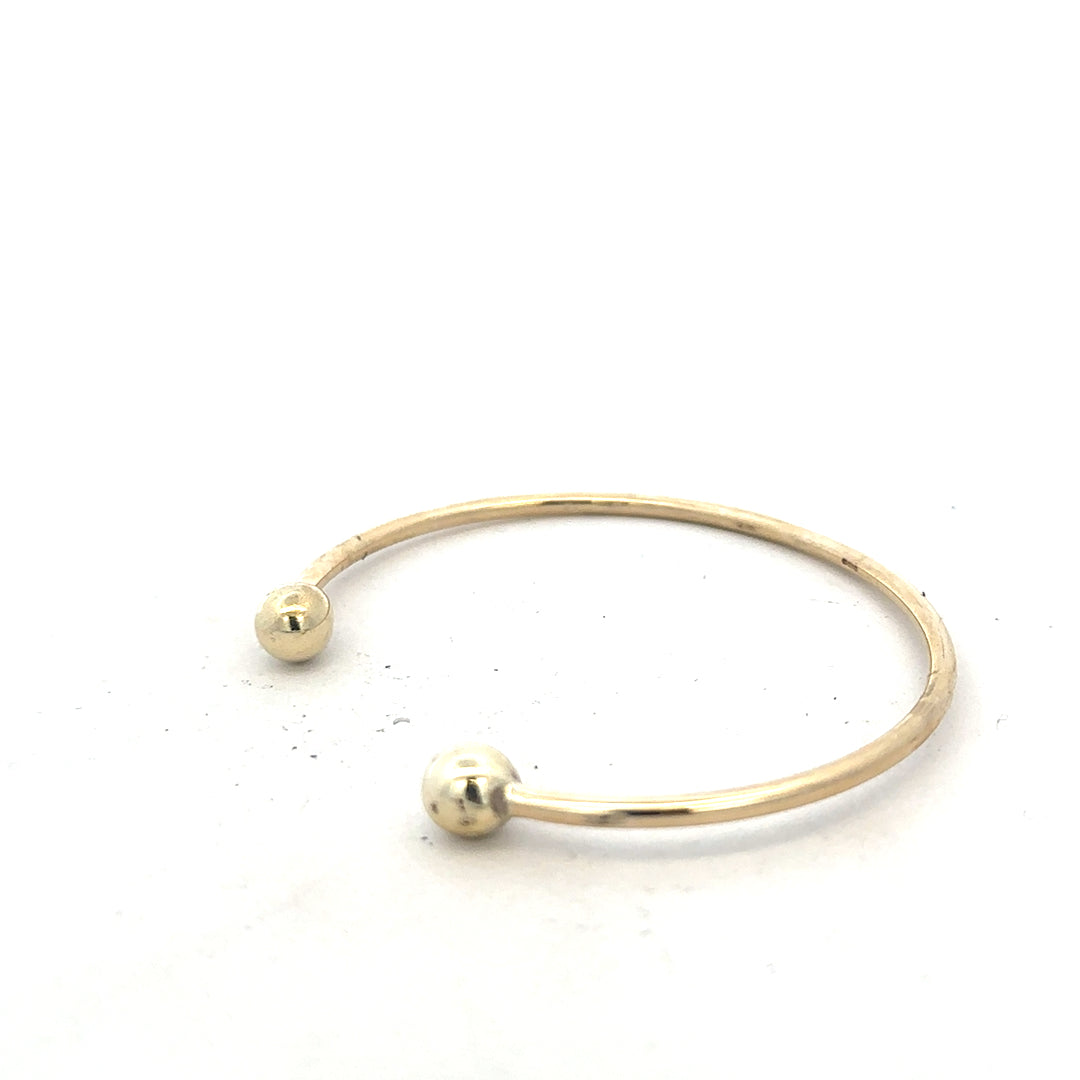 9ct yellow gold bracelet bangle weighing 12.7g with a smooth, polished finish, unbranded jewelry accessory.