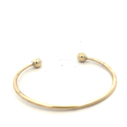 9ct yellow gold bracelet bangle weighing 12.7g, unbranded, with a smooth, polished finish and classic design.