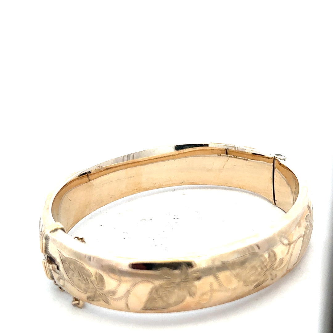 9ct yellow gold bracelet bangle weighing 20.3g, unbranded, with a smooth polished finish and classic design.