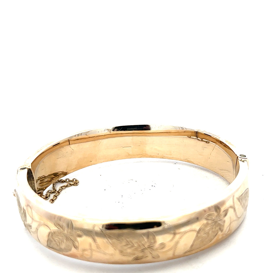 9ct yellow gold bracelet bangle weighing 20.3g, unbranded, with a smooth, polished finish and rounded design.