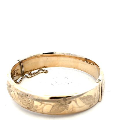 9ct yellow gold bracelet bangle weighing 20.3g, unbranded, showing smooth polished surface and classic circular shape.
