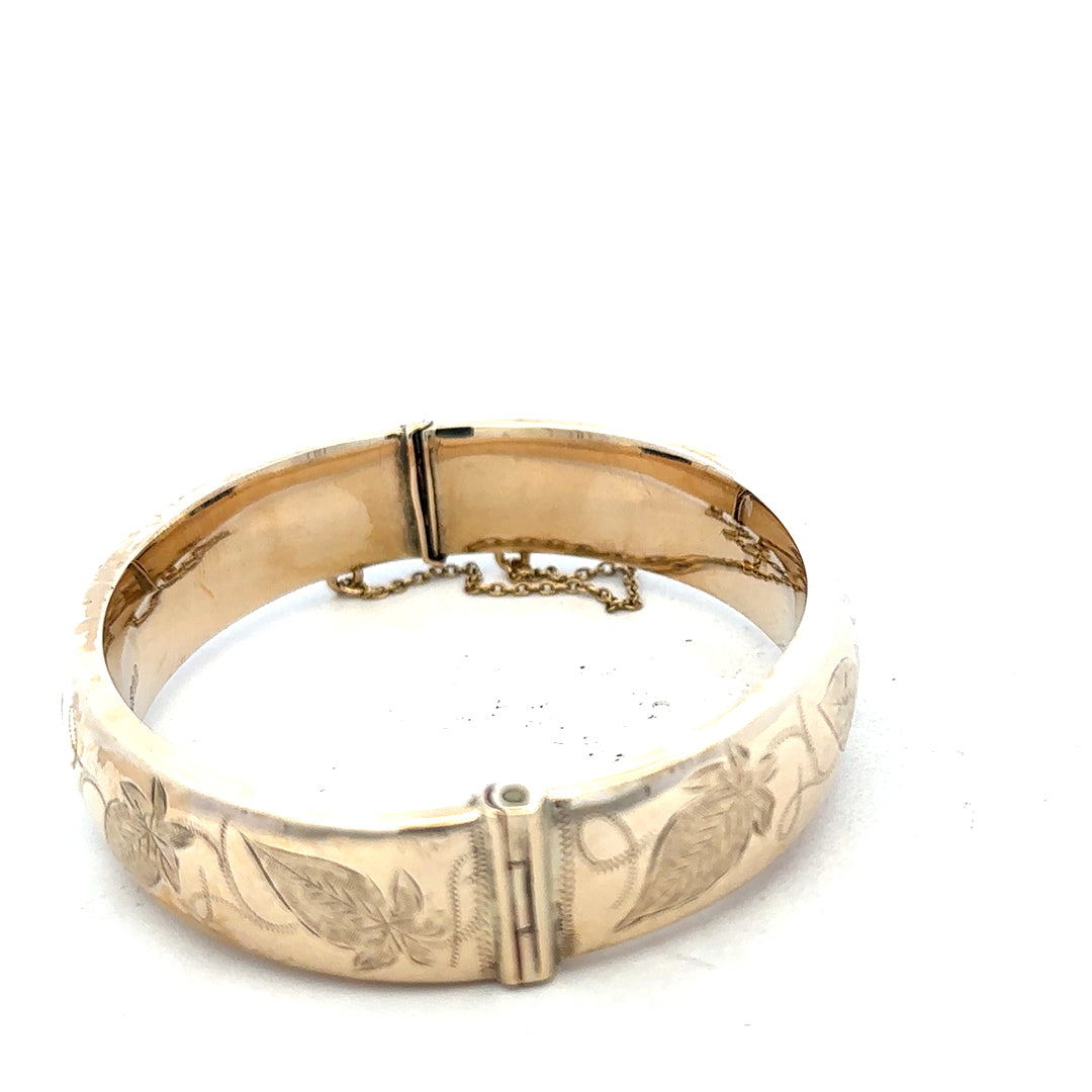 9ct yellow gold bracelet bangle, unbranded, with a smooth design, weighing 20.3 grams, displayed on a plain background.